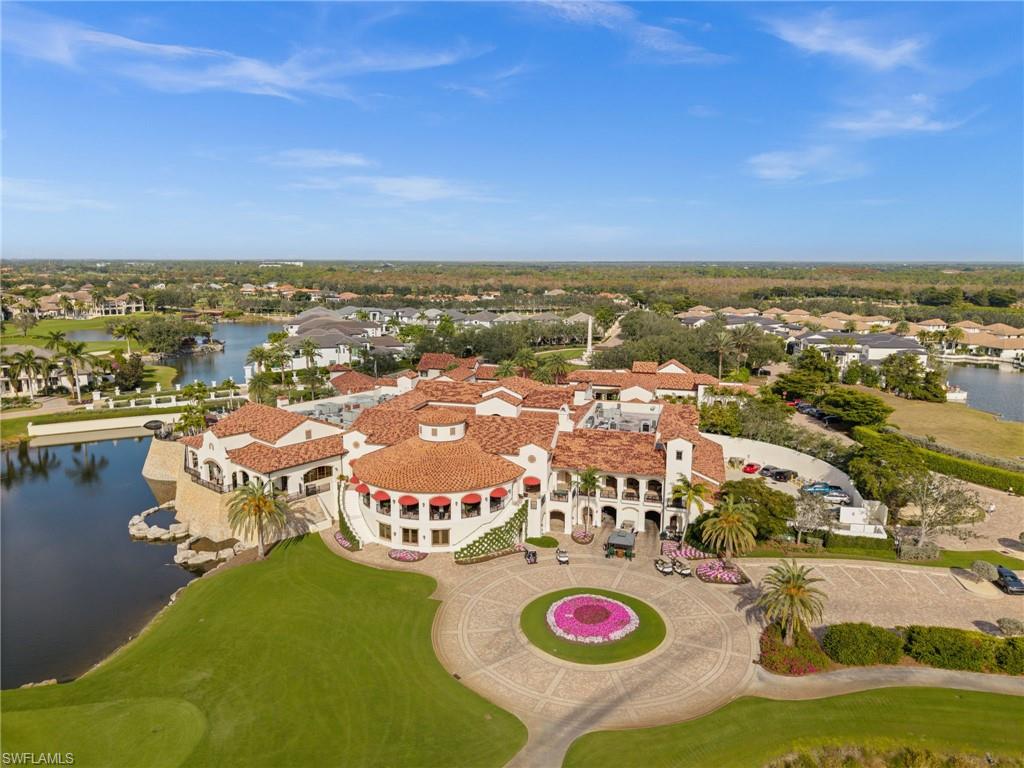 Aerial view of residential area featuring a large body of water