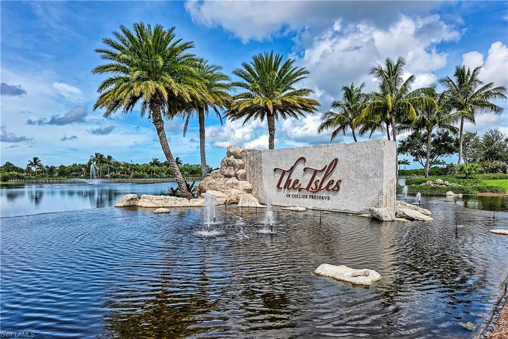 Community sign with a water view