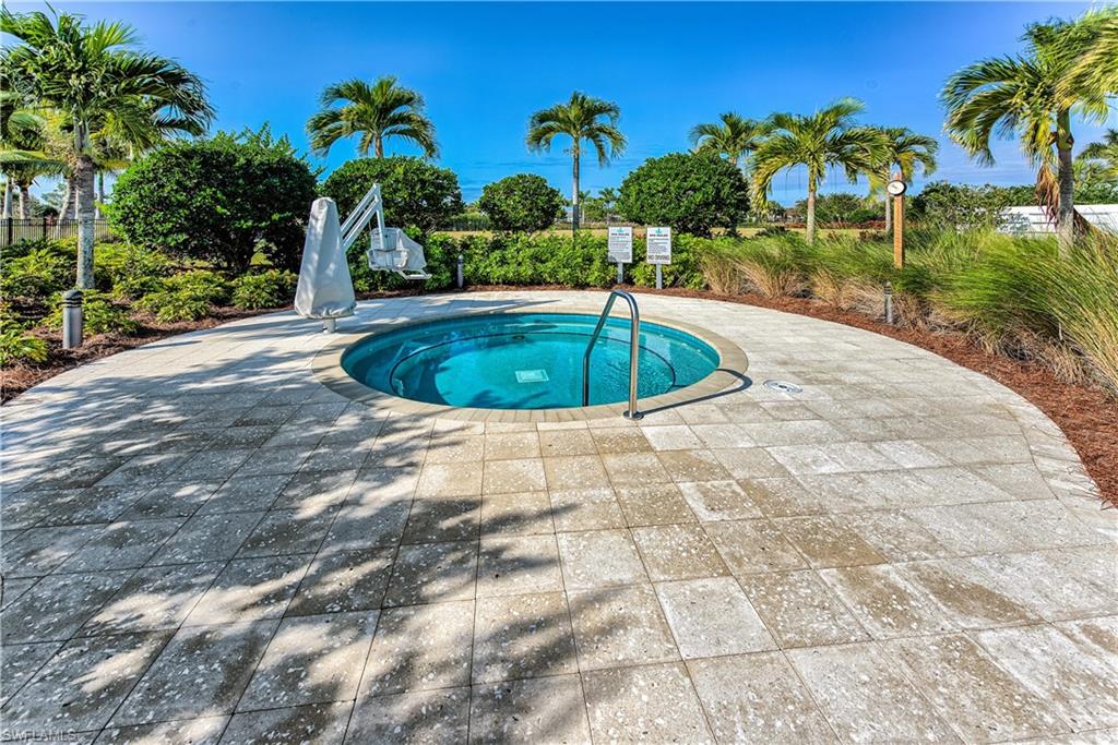 View of pool featuring a hot tub