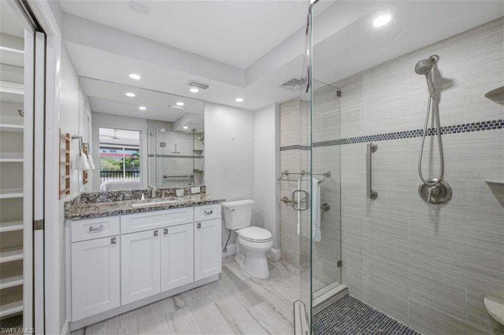 Master bathroom with glass shower and walk in closet