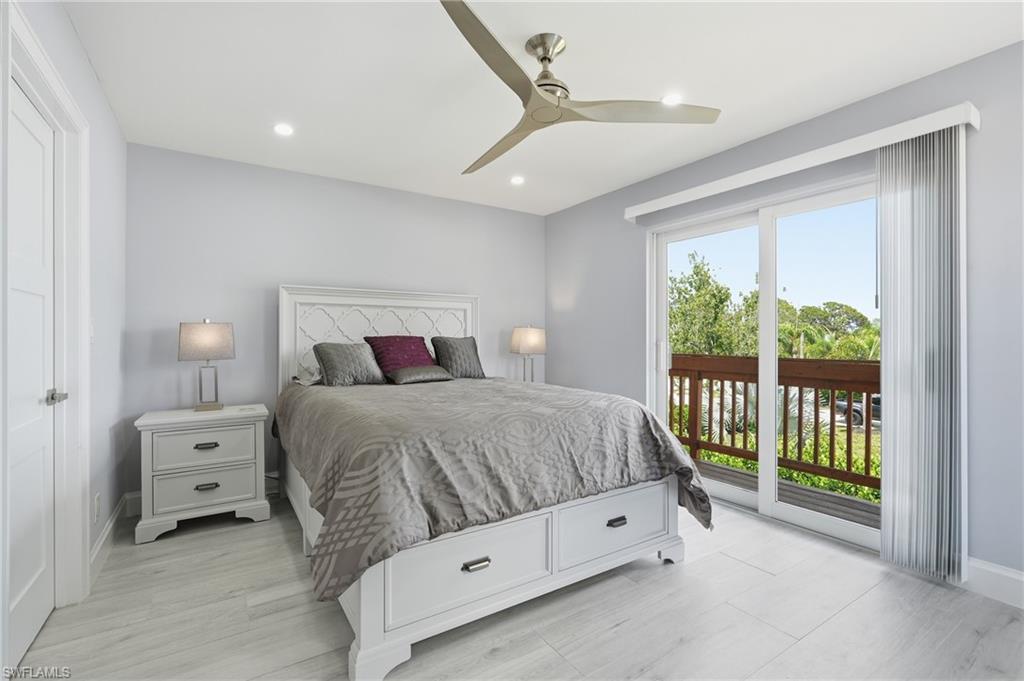 Bedroom featuring wood-finish flooring, recessed lighting, and a modern ceiling fan