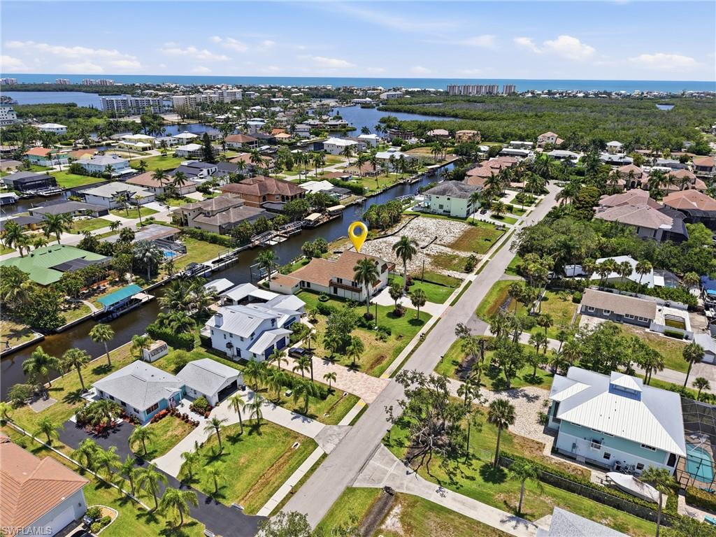 Aerial perspective highlighting a waterfront property with direct canal access
