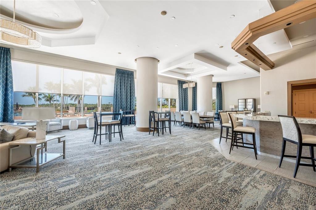 Spacious social room overlooking the pool & views.