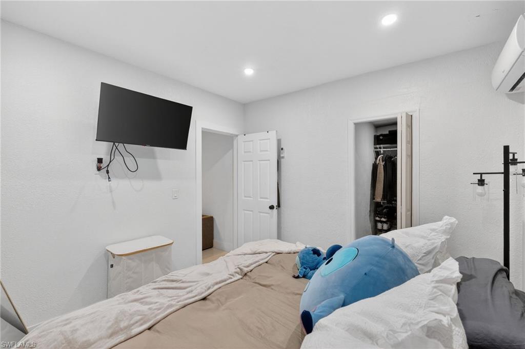 White walls and ceiling with recessed lighting