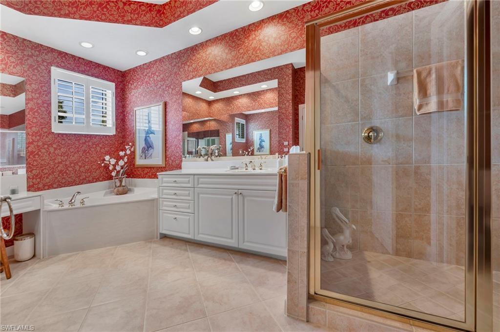 Spacious Master Bath with shower, tub, dual sinks.