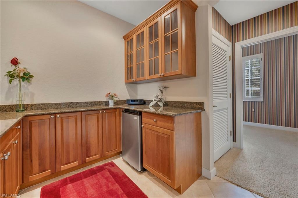 Fabulous room for entertaining with refrigerator, sink and plenty of cupboards