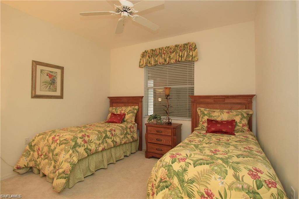 Carpeted bedroom with ceiling fan