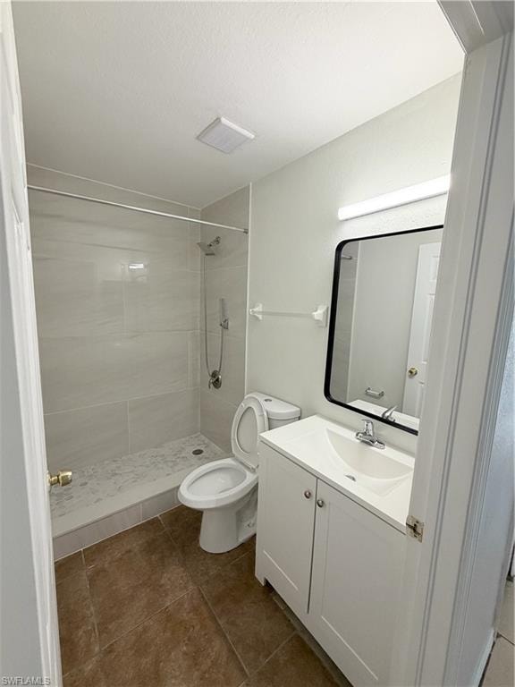White vanity with integrated sink, black-framed mirror, and chrome fixtures