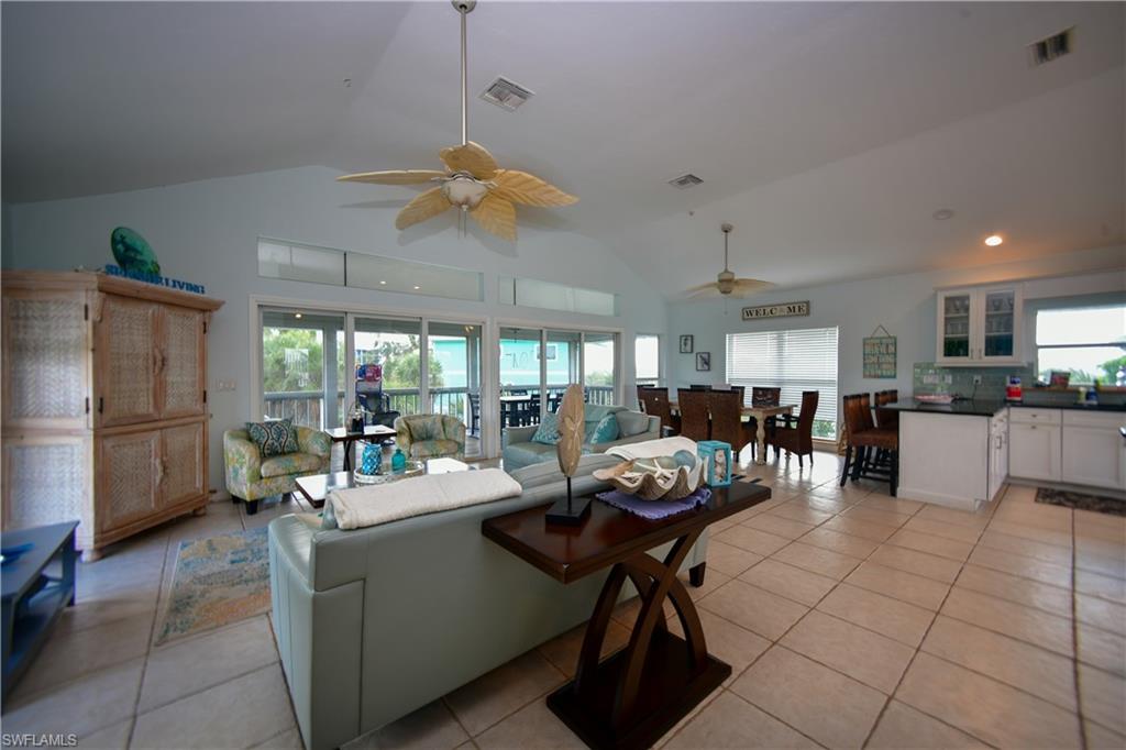 Vaulted ceiling great room with ceramic tile flooring