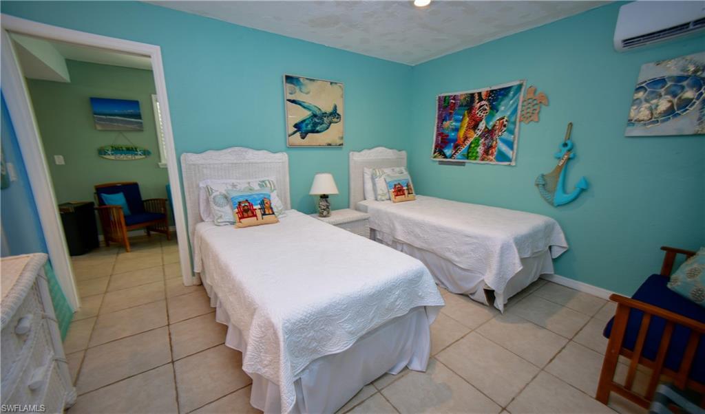 Room featuring tile flooring and light blue walls