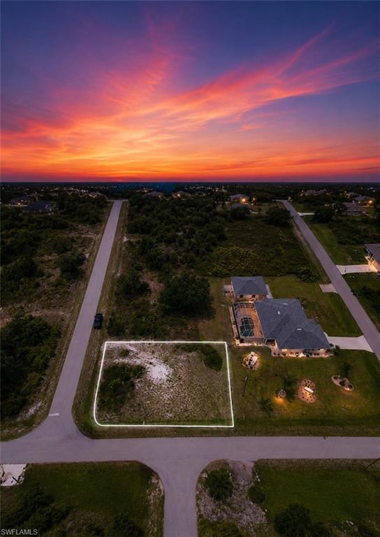 Vacant land parcel located at a paved intersection