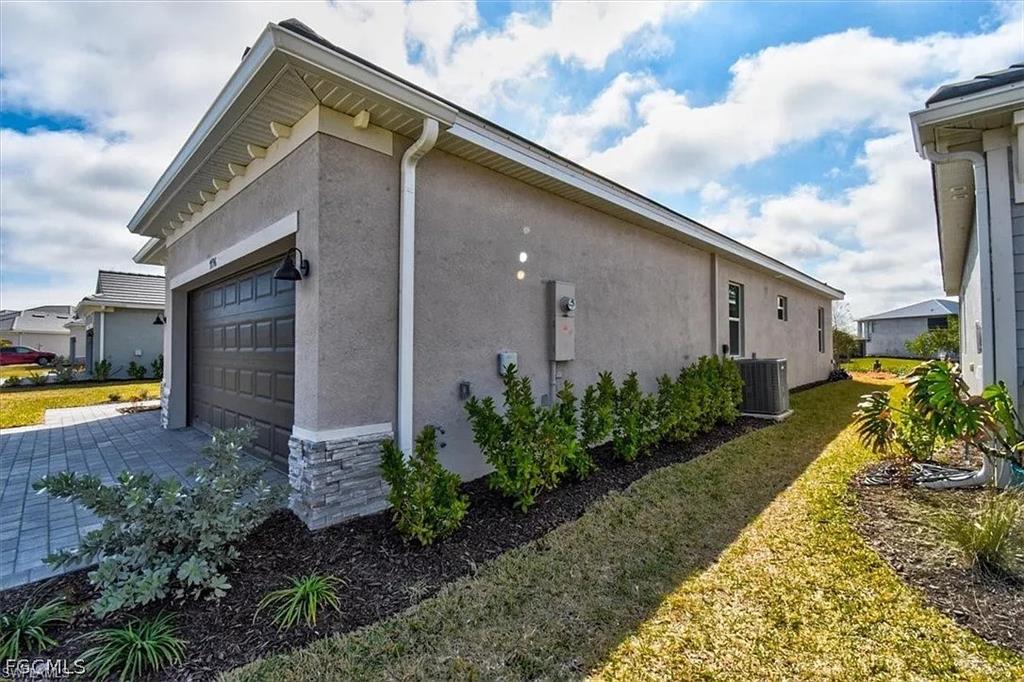 Stucco exterior with stone veneer accents