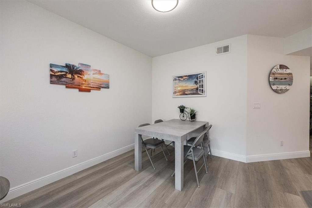 Dining room featuring wood-type flooring