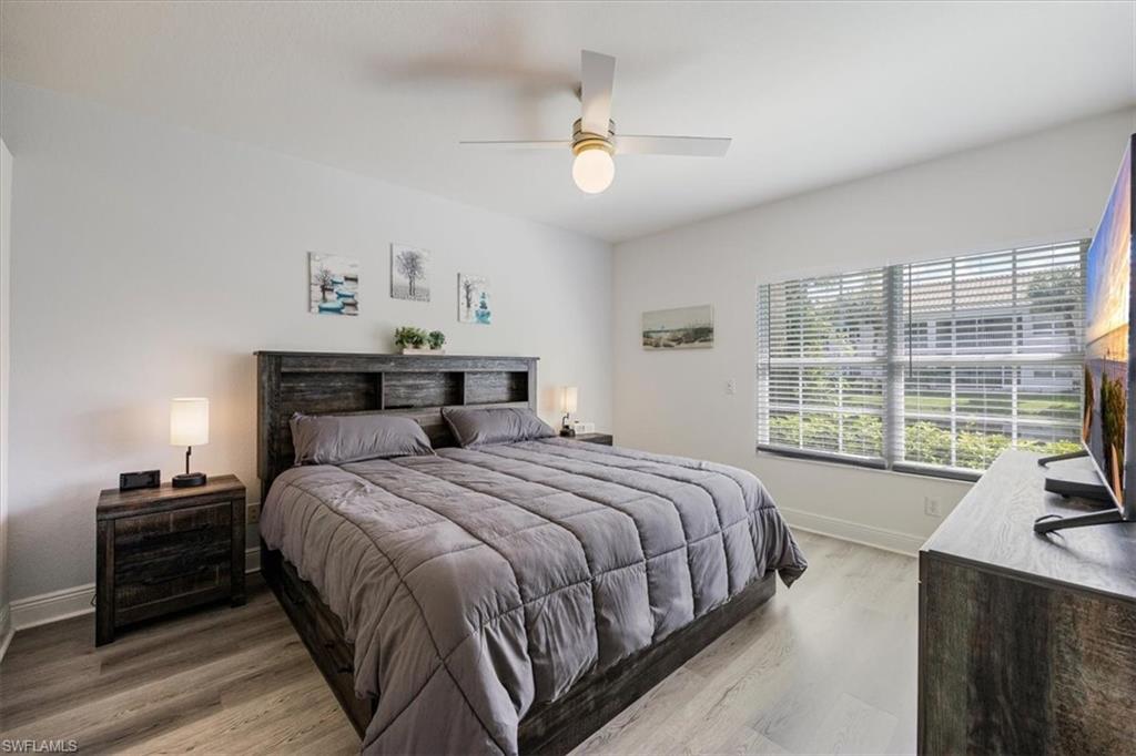 Bedroom featuring wood-type flooring and ceiling fan