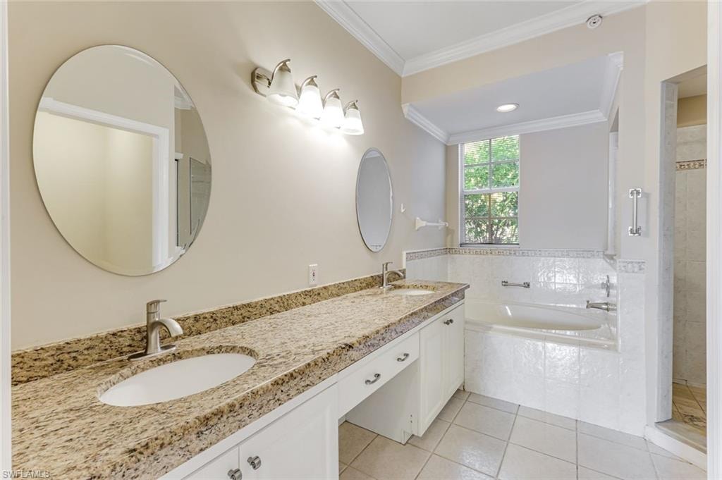 Bathroom featuring a dual vanity with granite countertops, undermount sinks, and contemporary brushed nickel faucets