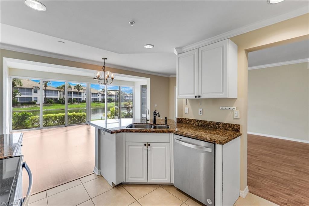 Kitchen featuring white cabinetry, a stainless steel dishwasher, and granite countertops