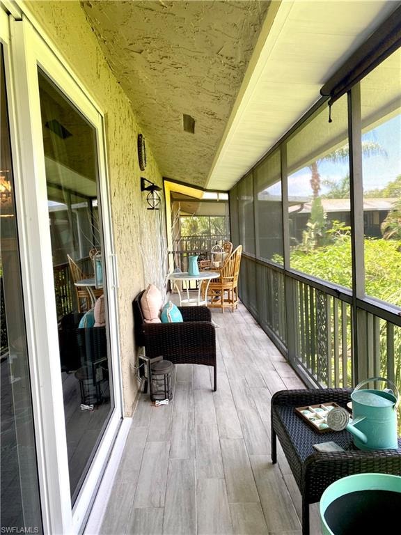Screen enclosed balcony overlooking the 13th tee of the Pines