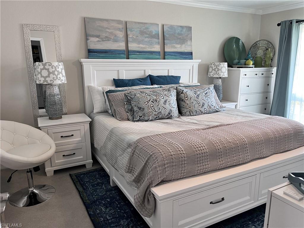 Guest Bedroom with King Bed with extra storage, dressers, TV and an office desk with chair