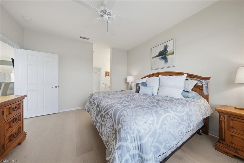 Light-toned wood-finish flooring complements neutral wall tones