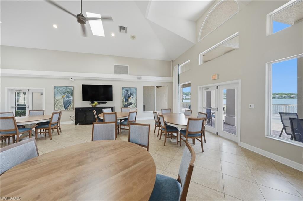 Spacious common area featuring vaulted ceilings, recessed lighting, and skylights