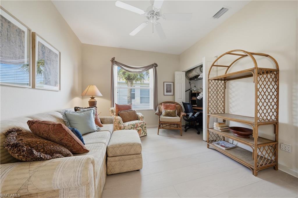 Vaulted ceiling with a ceiling fan, recessed lighting, and light-toned flooring
