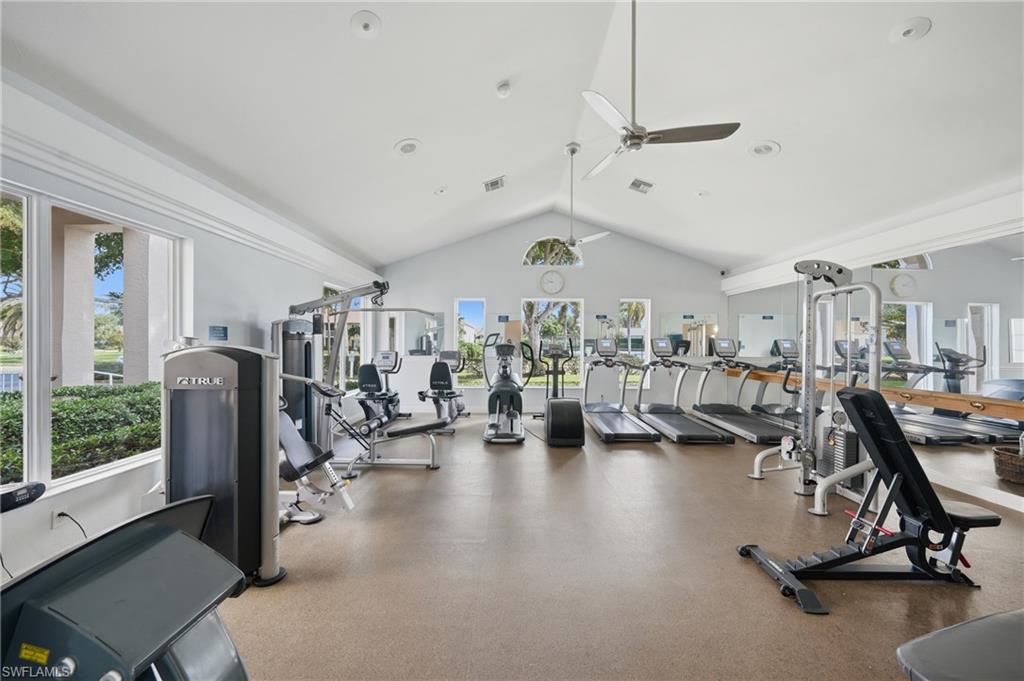 Fitness center featuring multiple exercise machines, vaulted ceiling, recessed lighting, and ceiling fans
