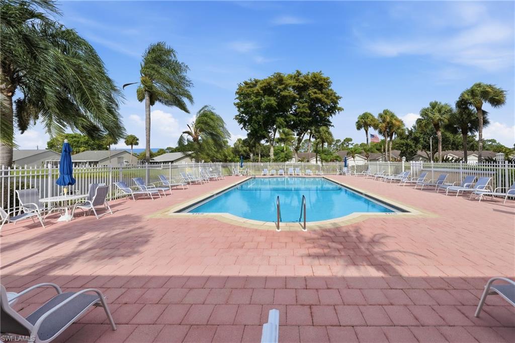 Outdoor swimming pool with integrated steps and a surrounding paver deck