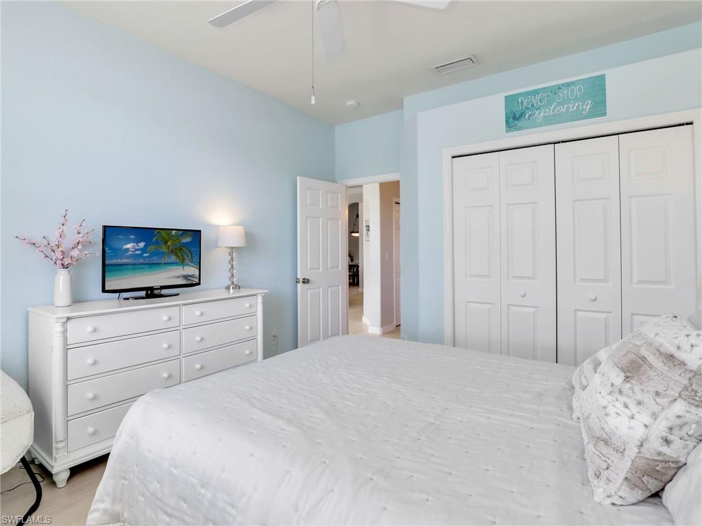 Bedroom with a closet, a ceiling fan, and light wood-style floors