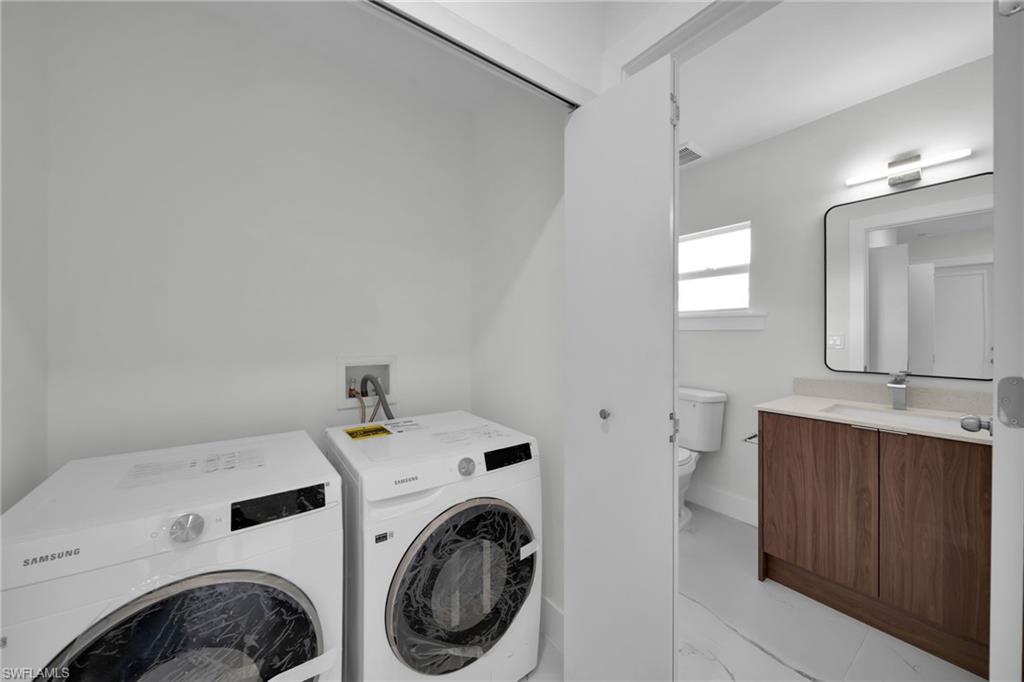 Dedicated laundry area with side-by-side appliances