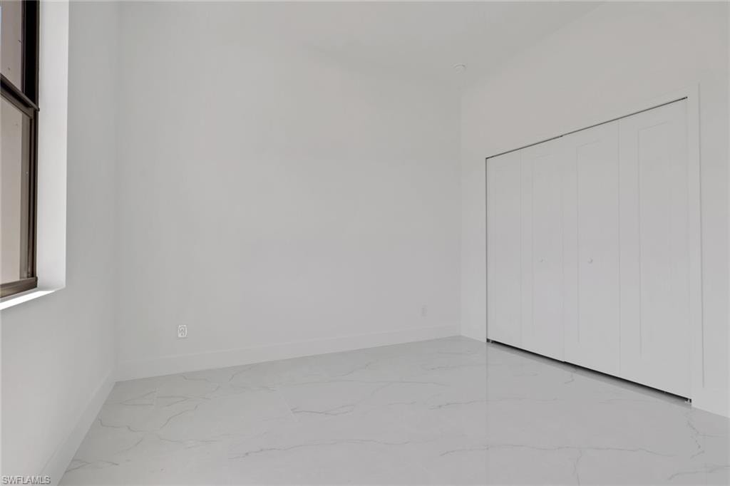 Guest bedroom 3 with view of closet