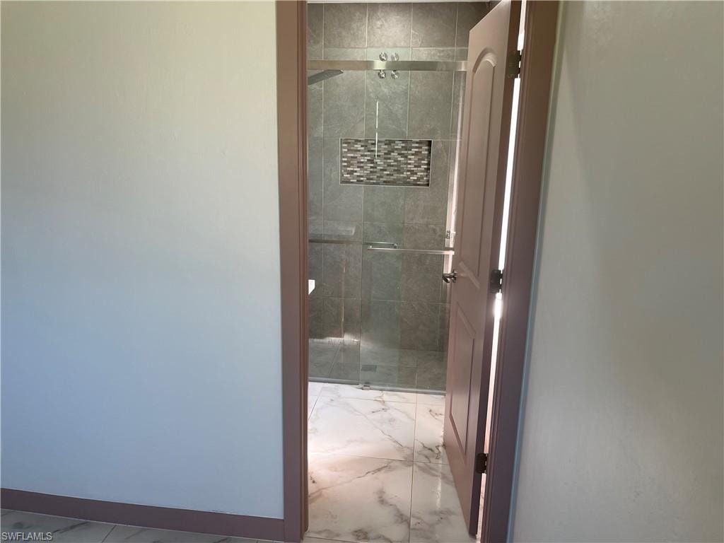 Bathroom with a shower with door
