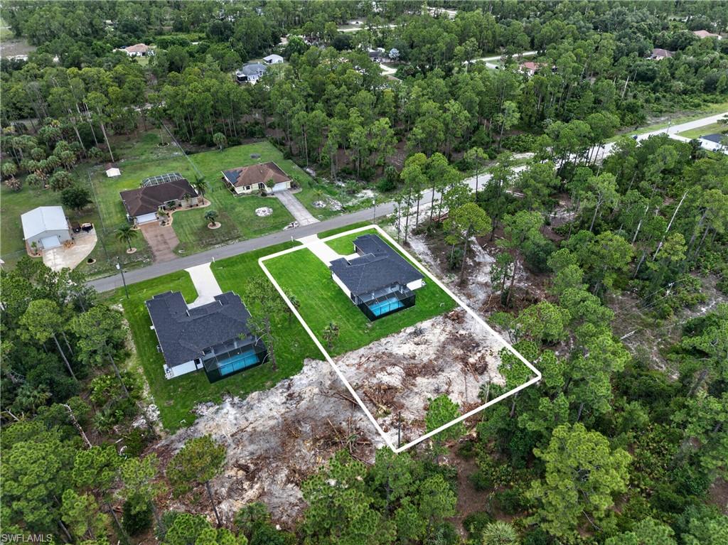 Expansive wooded lot offering privacy and development potential