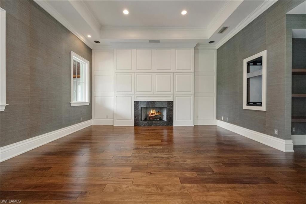 Open for custom interior design surrounding a gas fireplace