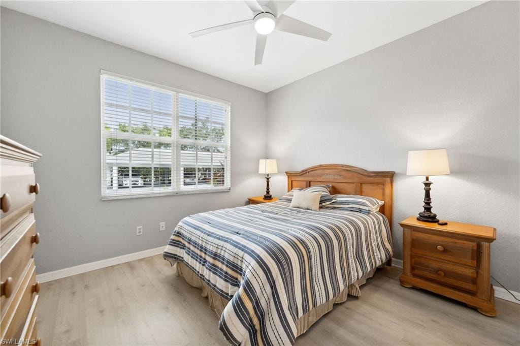 Bedroom featuring light hardwood / wood-style floors and ceiling fan