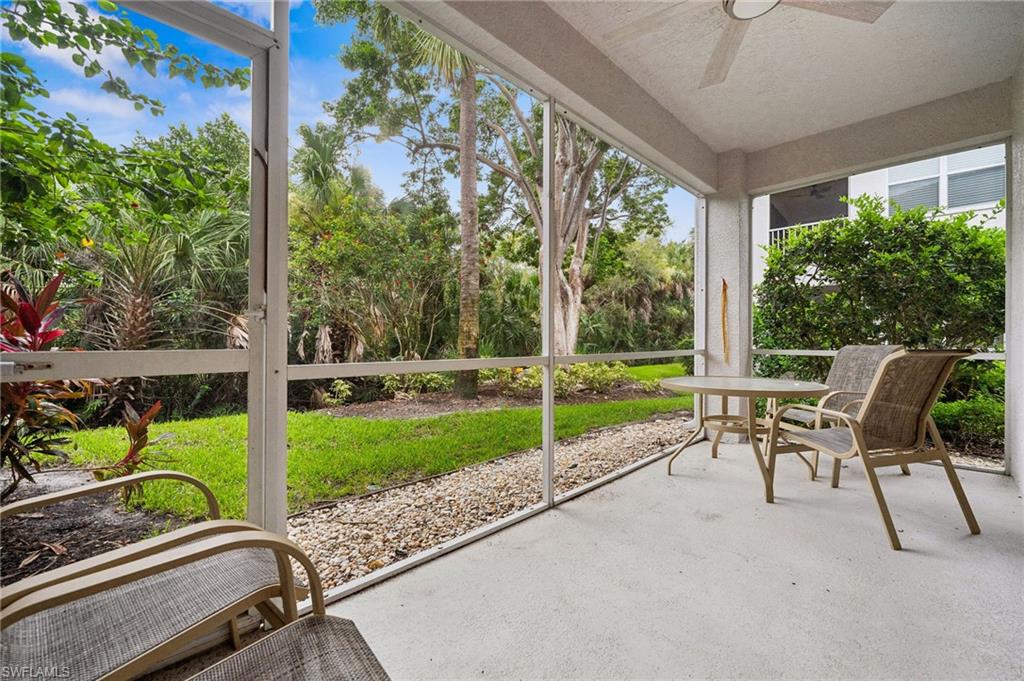 Unfurnished sunroom featuring ceiling fan