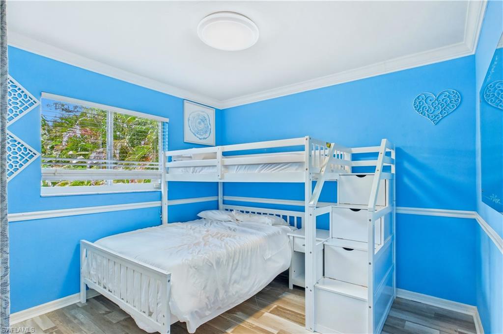 Blue-painted interior room featuring crown molding