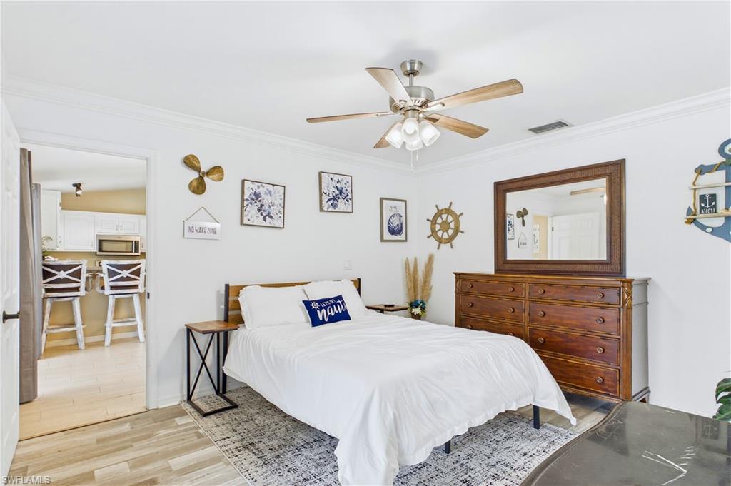 Room crown molding, and a ceiling fan with integrated lighting