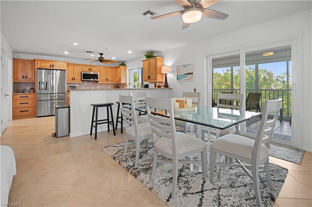 kitchen, breakfast bar, and dining room