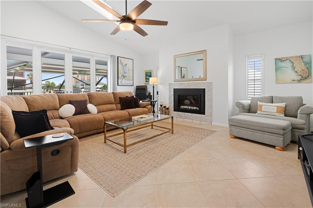 Living room with french doors leading to 2nd level balcony