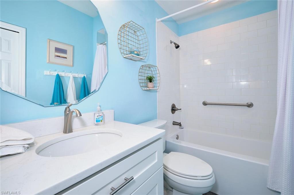 Bathroom featuring shower / bath combo and vanity