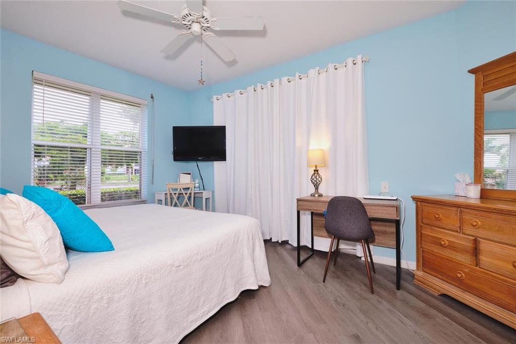 Bedroom featuring wood finished floors and ceiling fan
