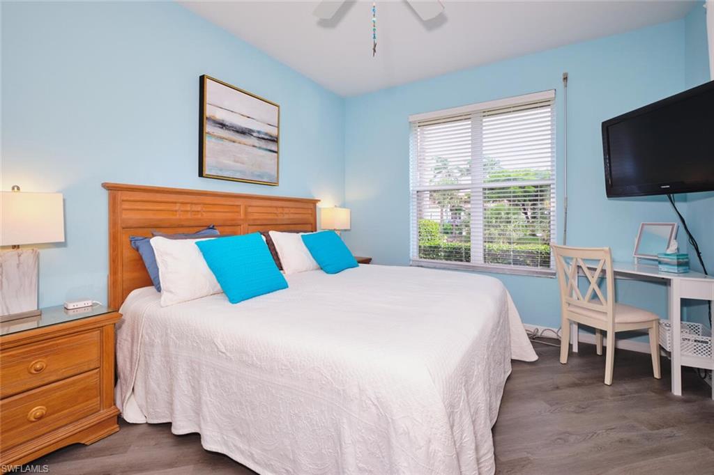 Bedroom featuring wood finished floors and a ceiling fan