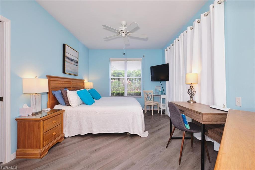 Bedroom with wood finished floors and ceiling fan