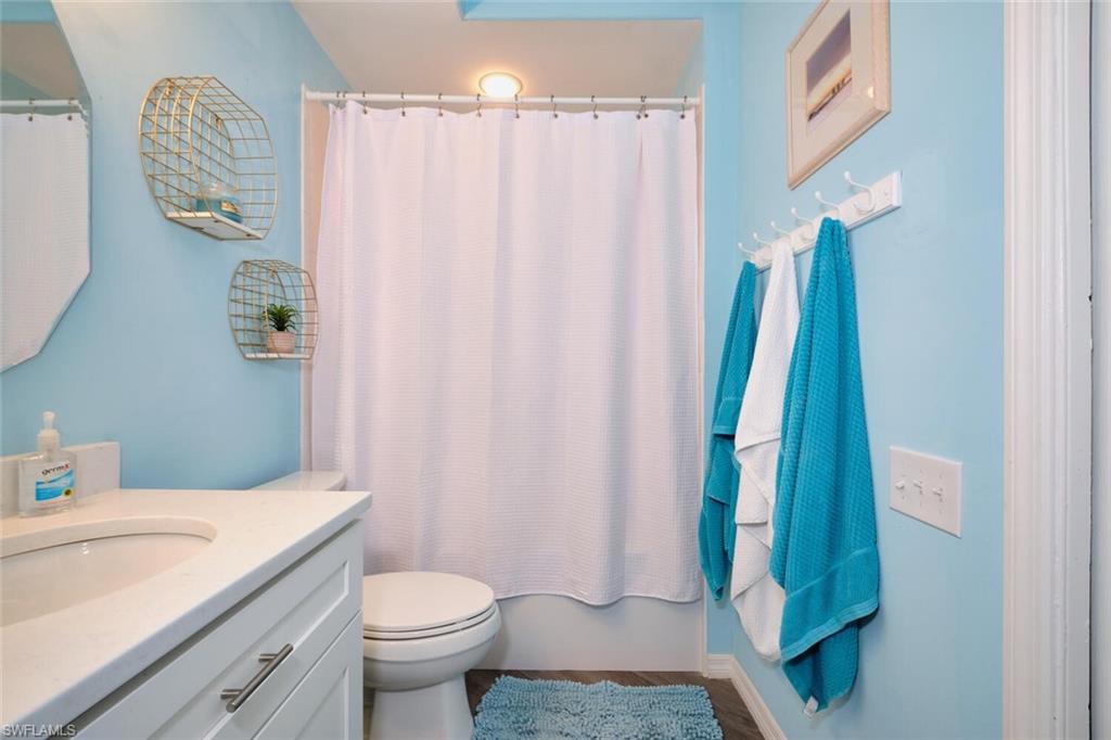 Bathroom with vanity and wood finished floors
