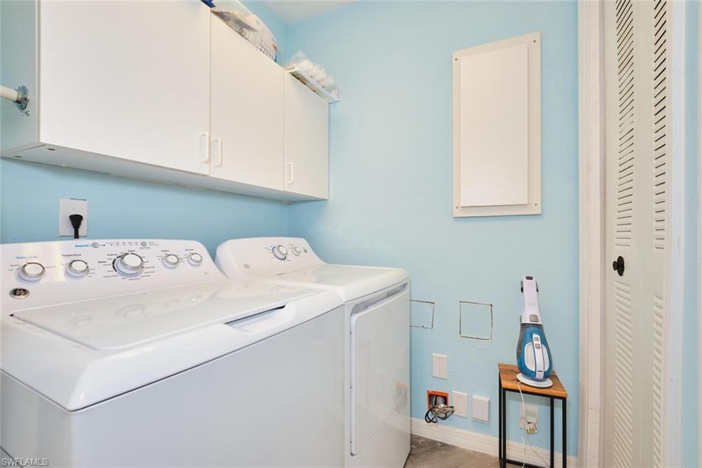 Laundry area with cabinet space and washer and dryer