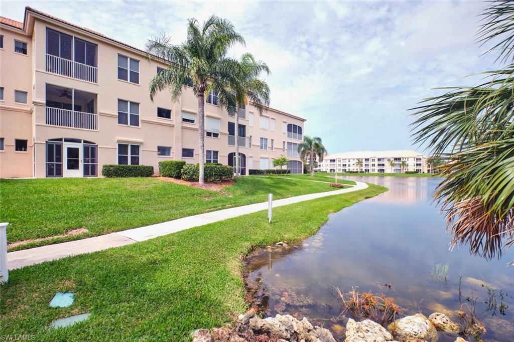 View of apartment building / complex with a water view