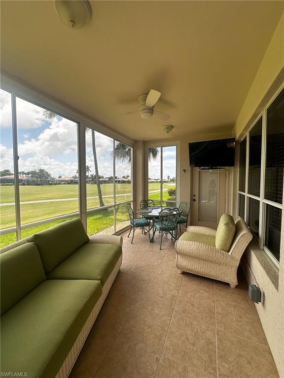 Sunroom featuring a ceiling fan, an outdoor hangout area, and outdoor dining area