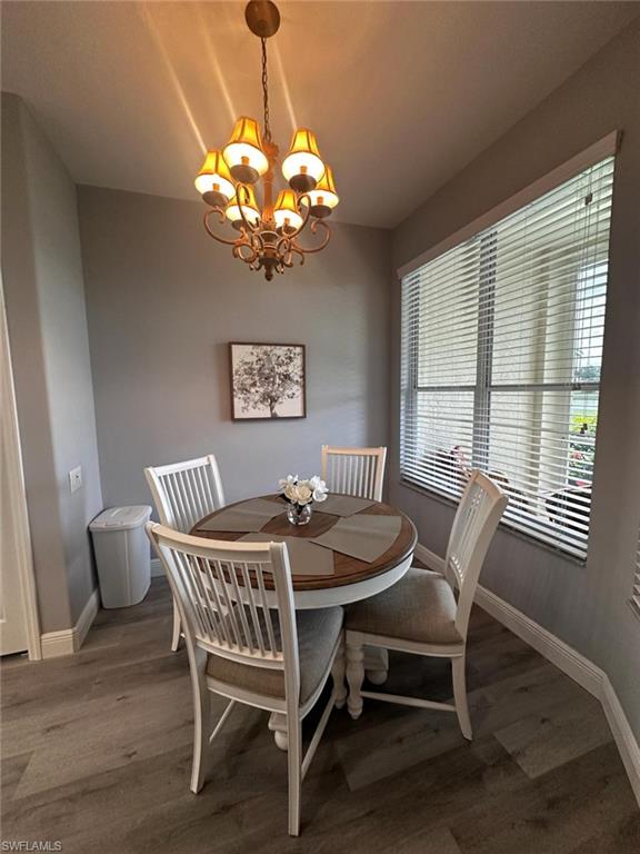 Dining room featuring a chandelier and wood finished floors