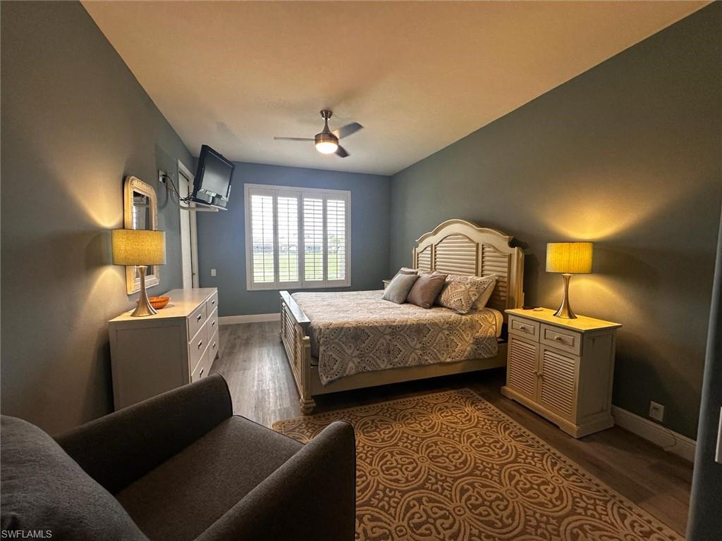 Bedroom with wood finished floors and a ceiling fan