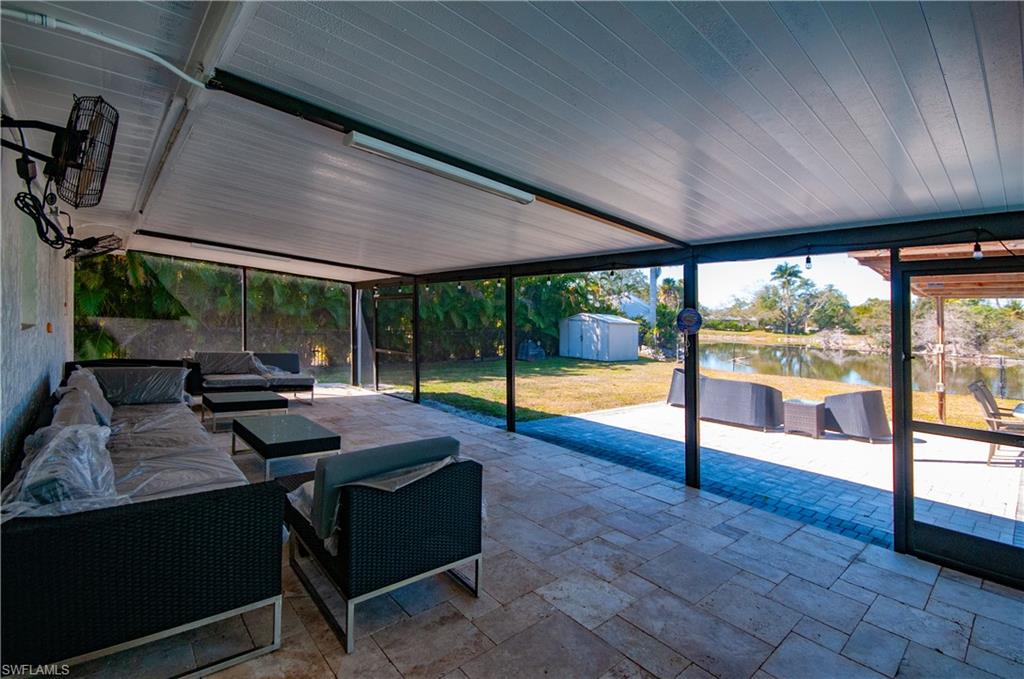 View of SCREENED PORCH with outdoor OVER SIZED PORCH SCREEND IN lounge area, VIEWS BACK YARD, LAKE,